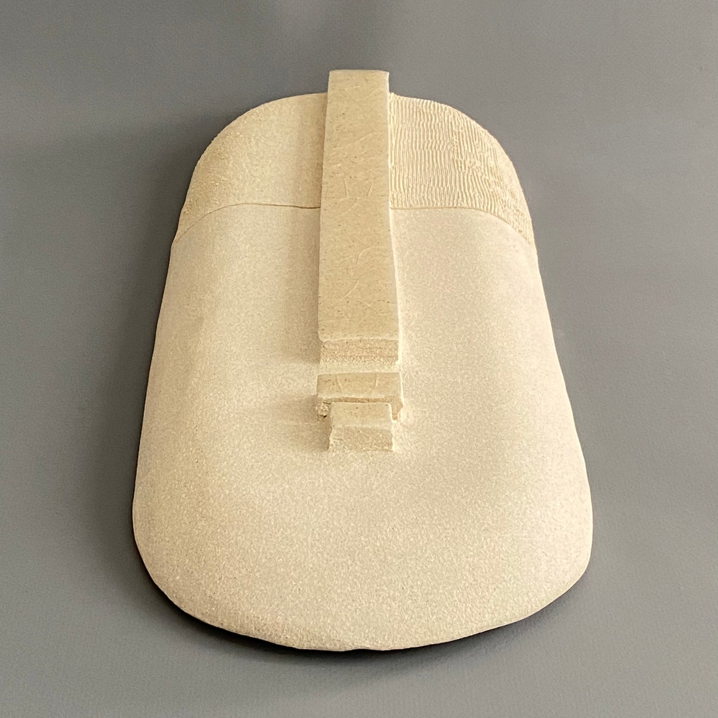 Masque en grès beige mat et brillant
